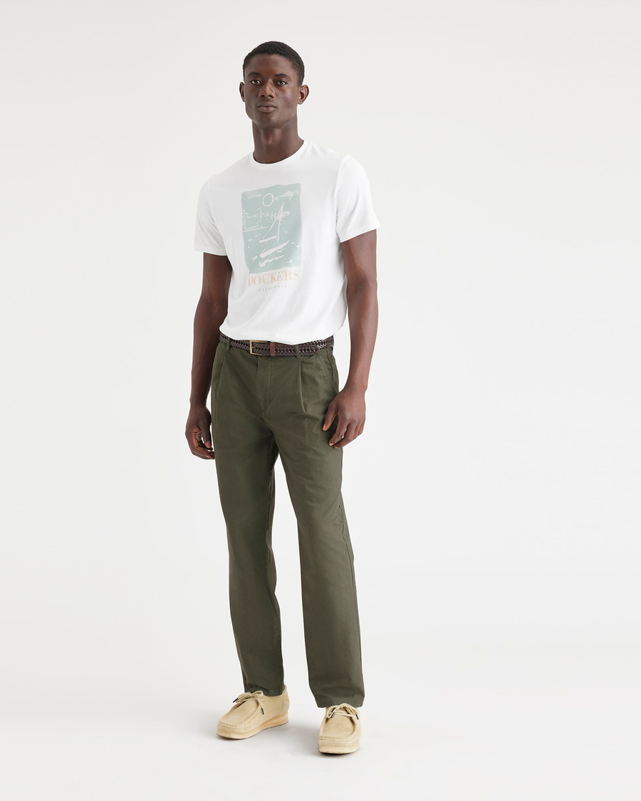 Front view of model wearing Army Green Men's Relaxed Taper Fit Original Pleated Chino Pants.