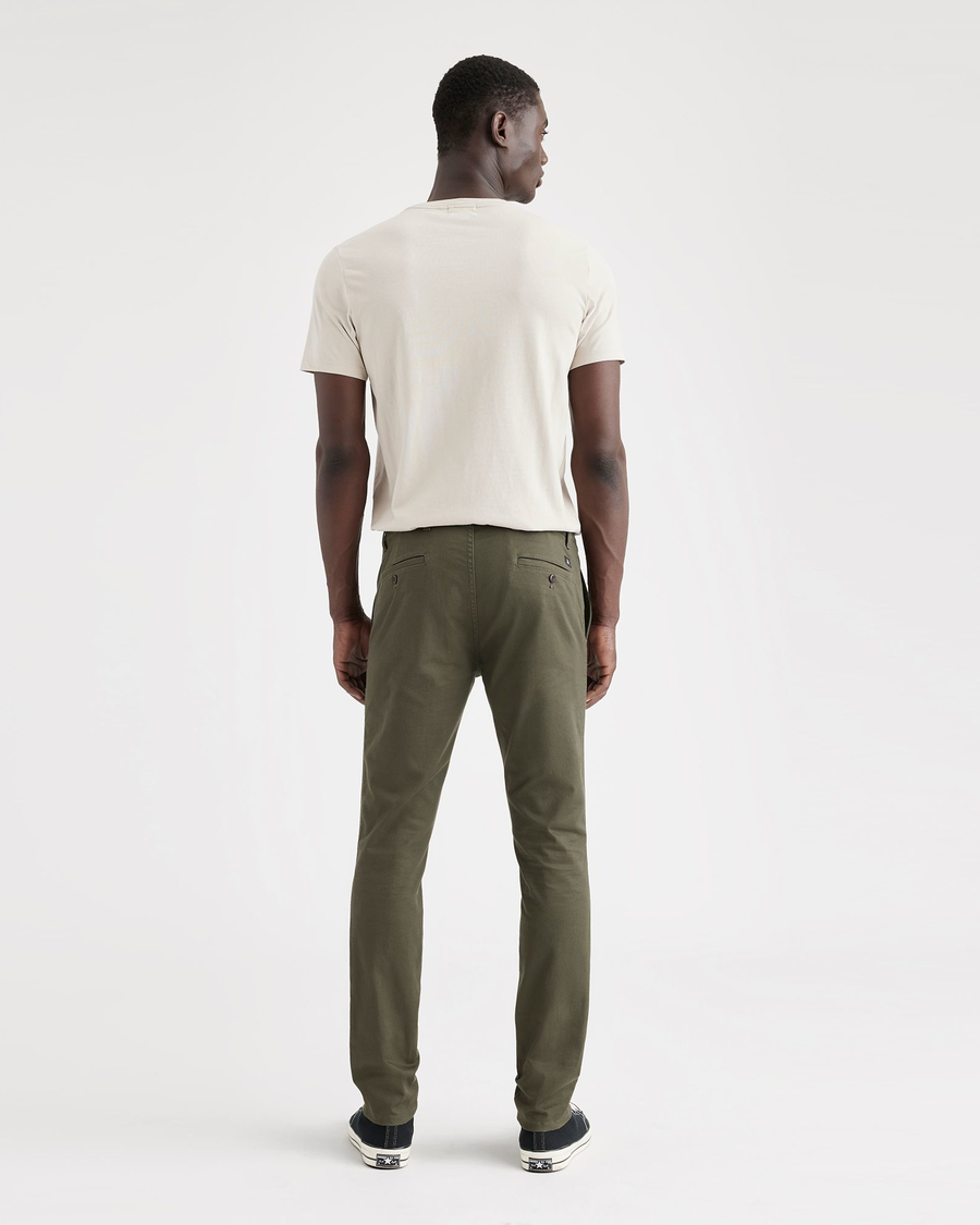 Back view of model wearing Army Green Men's Skinny Fit Original Chino Pants.