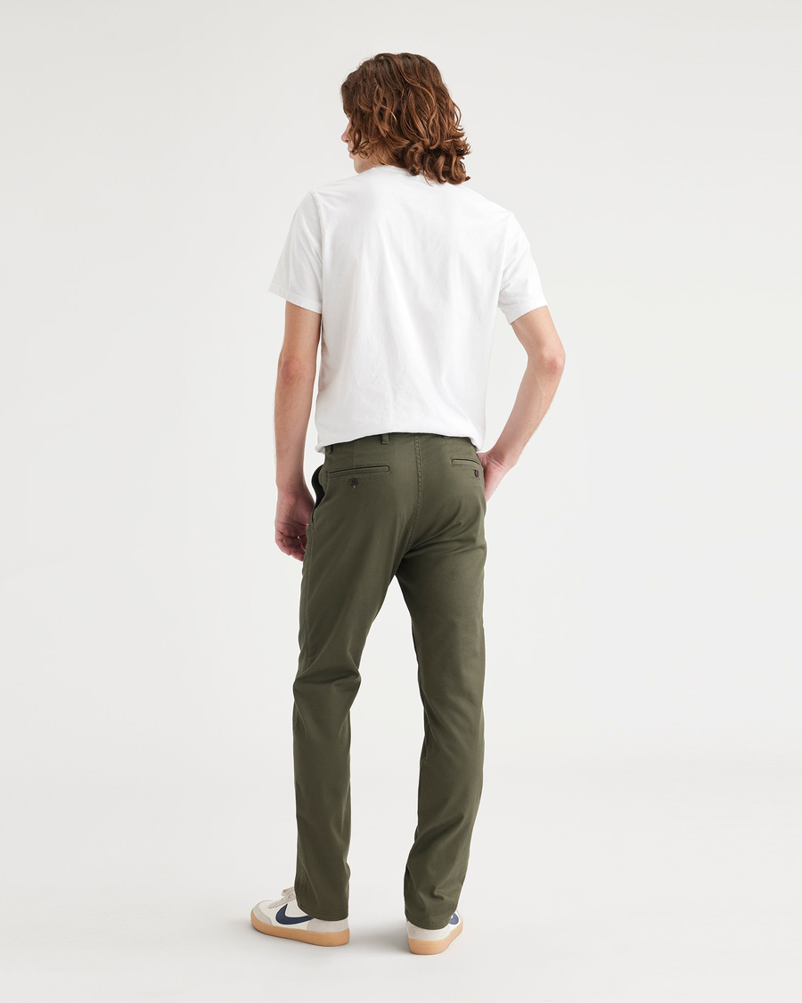 Back view of model wearing Army Green Men's Slim Fit Original Chino Pants.