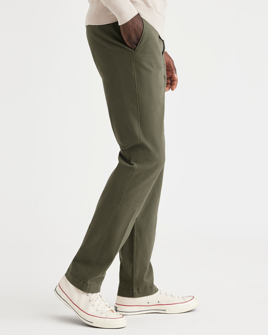 Side view of model wearing Army Green Men's Slim Fit Smart 360 Flex California Chino Pants.