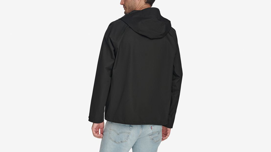 Back view of model wearing Beautiful Black Men's Performance Rain Hoodie Jacket.