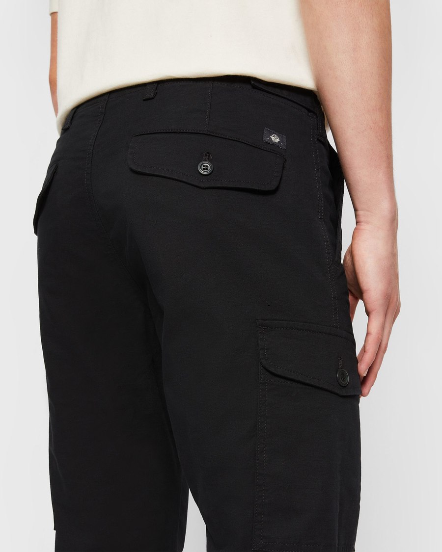 View of model wearing Beautiful Black Men's Slim Tapered Fit Cargo Pants.