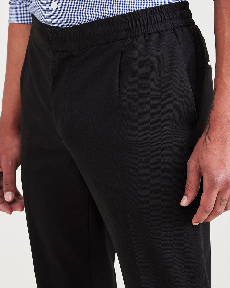 View of model wearing Beautiful Black Men's Slim Tapered Fit Refined Pull-On Pants.