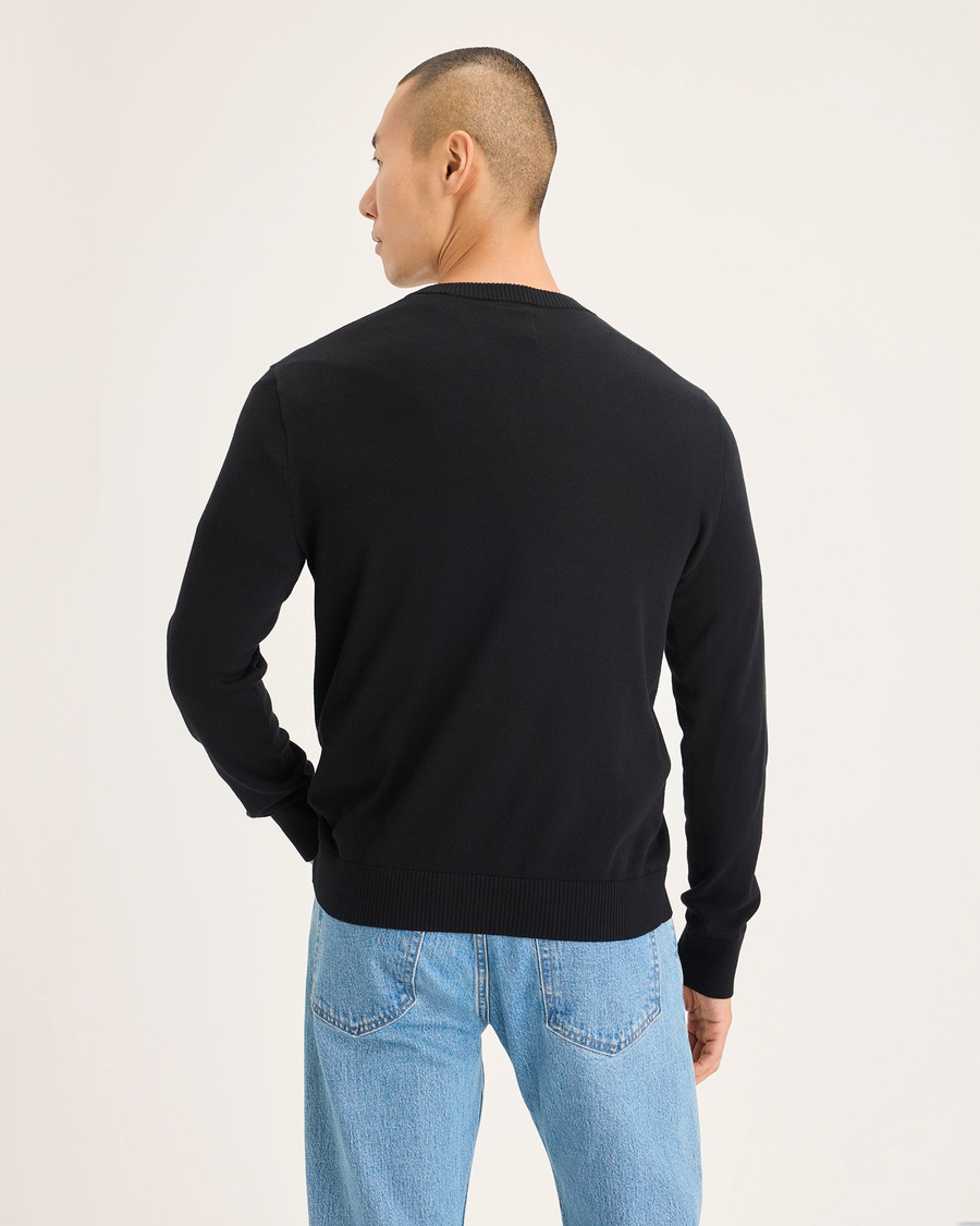 Back view of model wearing Beautiful Black V Neck Sweater.