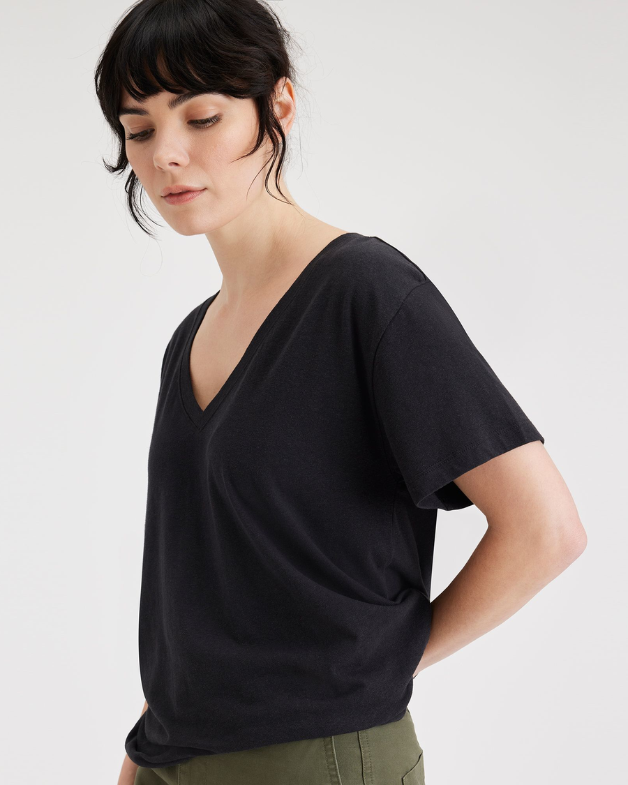 View of model wearing Beautiful Black Women's Deep V-Neck Tee Shirt.