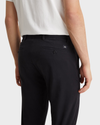 View of model wearing Black Men's Slim Fit Smart 360 Flex Alpha Chino Pants.