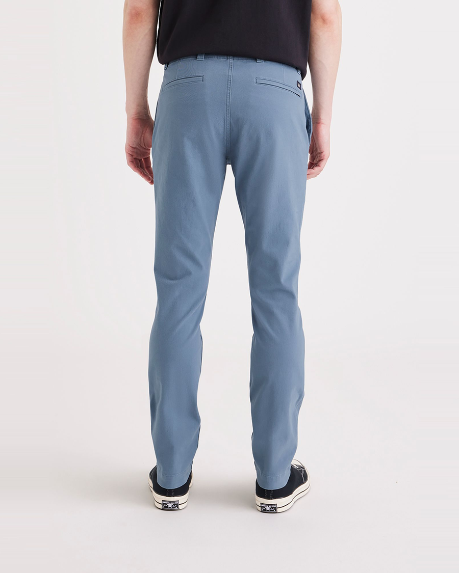 Back view of model wearing Bluefin Men's Skinny Fit Smart 360 Flex California Chino Pants.