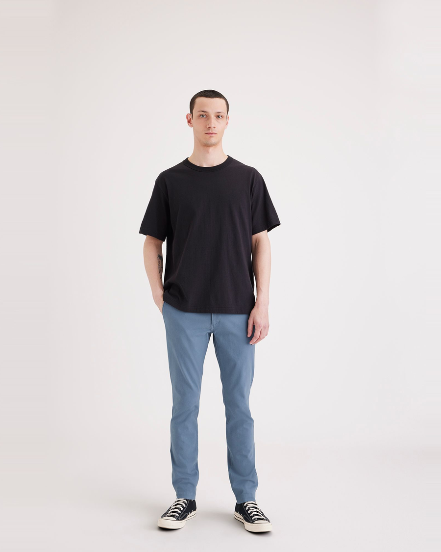 Front view of model wearing Bluefin Men's Skinny Fit Smart 360 Flex California Chino Pants.