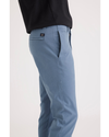 Side view of model wearing Bluefin Men's Skinny Fit Smart 360 Flex California Chino Pants.