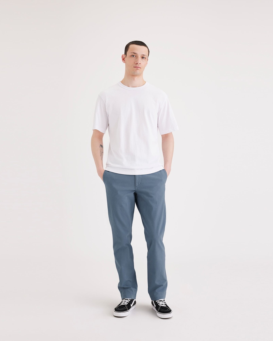 Front view of model wearing Bluefin Men's Slim Fit Smart 360 Flex California Chino Pants.