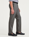 Side view of model wearing Burma Grey Signature Iron Free Khakis, Slim Fit with Stain Defender®.