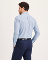 Back view of model wearing Burnett Subdued Blue Signature Shirt Long Sleeve with Stain Defender®, Slim Fit.