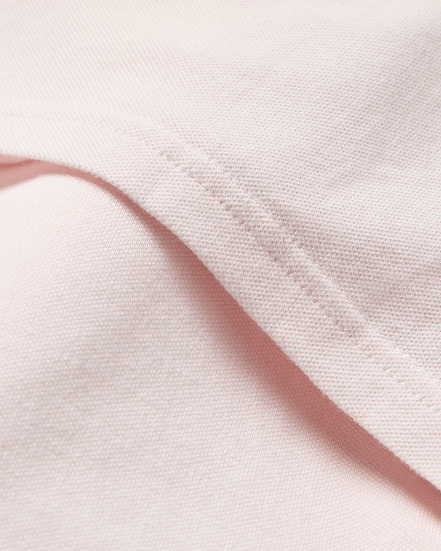 View of model wearing Calcite Pique Polo, Slim Fit.