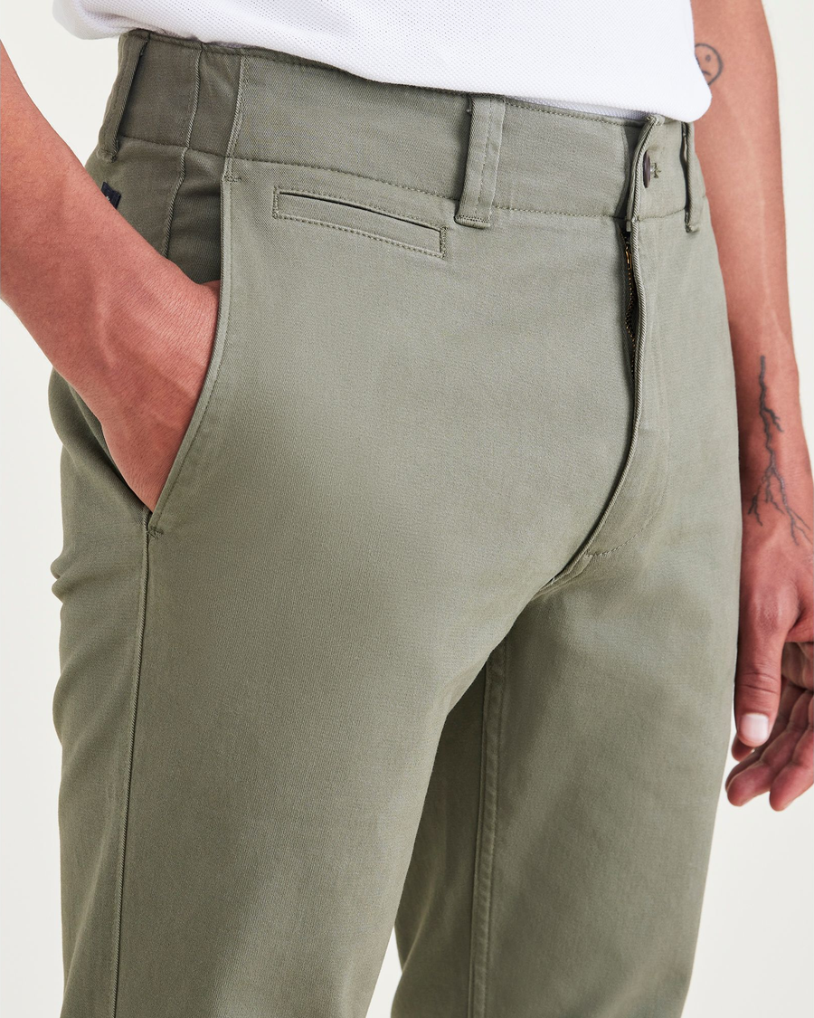 View of model wearing Camo Men's Skinny Fit Smart 360 Flex California Chino Pants.