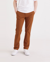 Front view of model wearing Caramel Café Men's Slim Fit Smart 360 Flex Alpha Chino Pants.