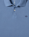 View of model wearing Coastal Fjord Pique Polo, Slim Fit.