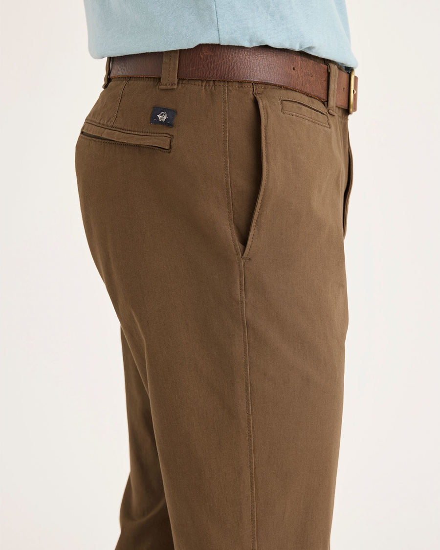 Side view of model wearing Coffee Liquer Men's Slim Fit Smart 360 Flex California Chino Pants.