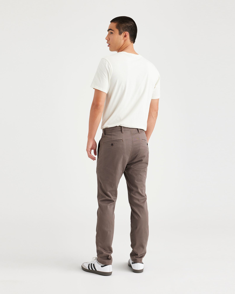 Back view of model wearing Coffee Quartz Men's Skinny Fit Original Chino Pants.