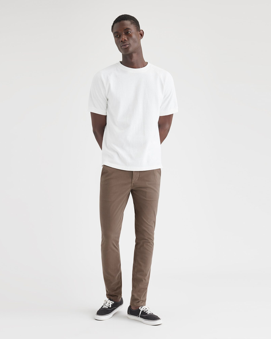 View of model wearing Coffee Quartz Men's Skinny Fit Supreme Flex Alpha Khaki Pants.