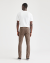 Back view of model wearing Coffee Quartz Men's Skinny Fit Supreme Flex Alpha Khaki Pants.