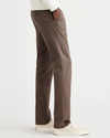 Side view of model wearing Coffee Quartz Men's Slim Fit Original Chino Pants.
