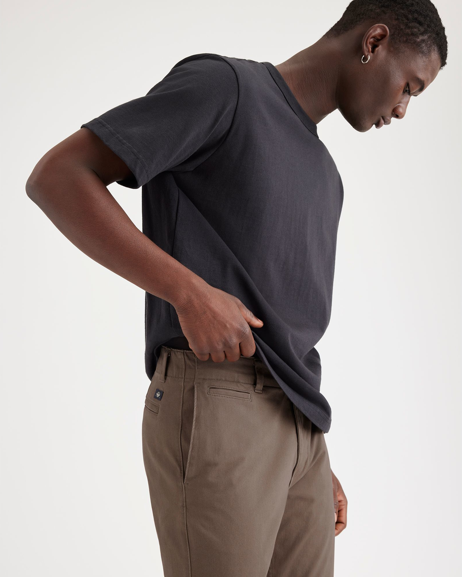 View of model wearing Coffee Quartz Men's Slim Fit Smart 360 Flex California Chino Pants.
