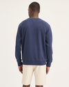 Back view of model wearing Crown Blue Men's Regular Fit Icon Crewneck Sweatshirt.