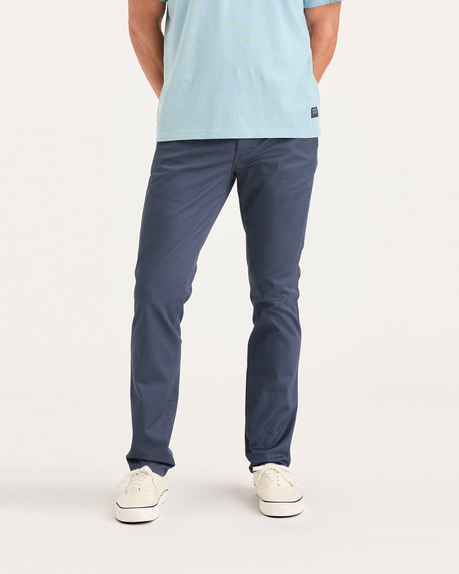 Front view of model wearing Crown Blue Men's Skinny Fit Original Chino Pants.