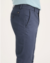 Side view of model wearing Crown Blue Men's Skinny Fit Original Chino Pants.