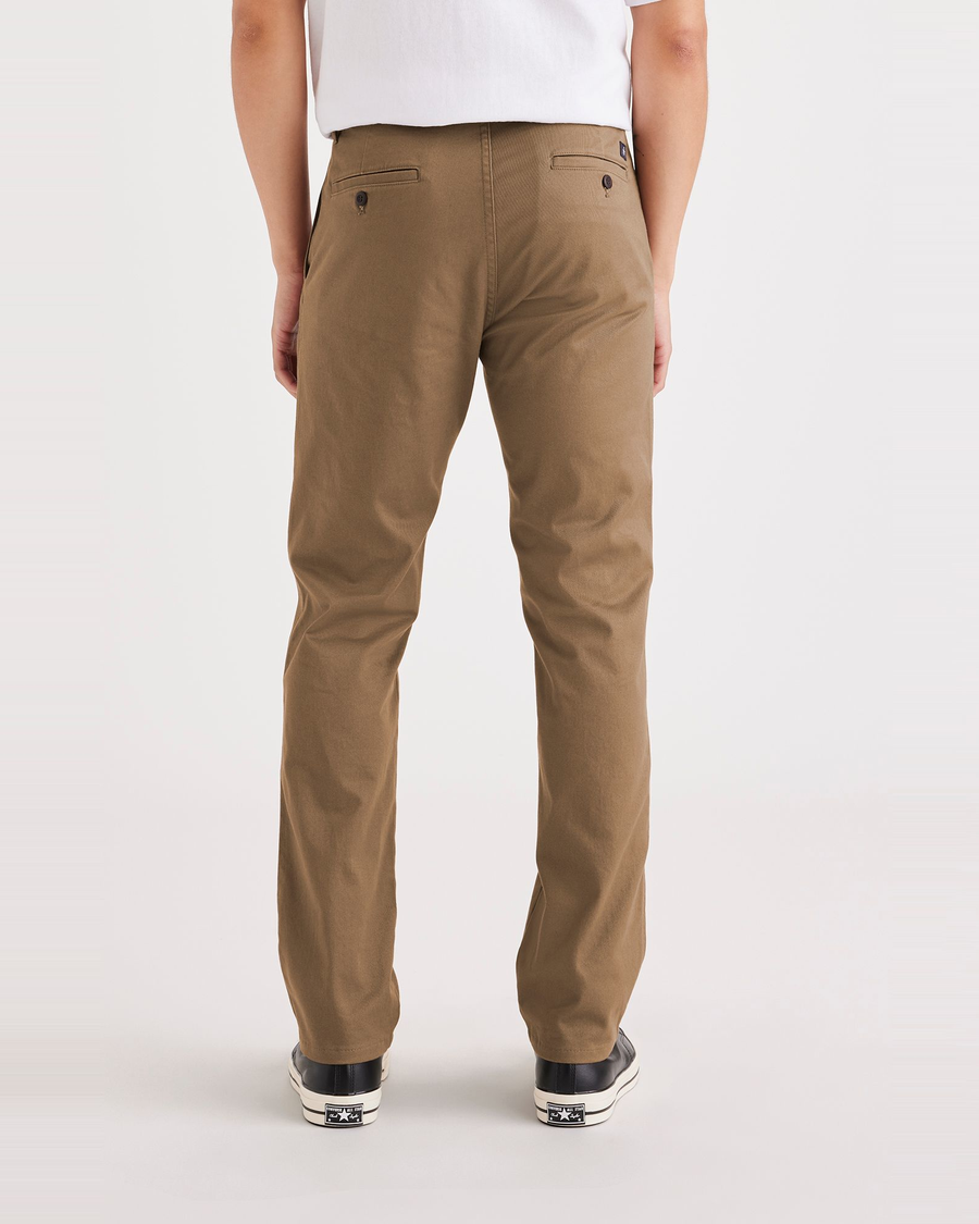 Back view of model wearing Cub Men's Slim Fit Original Chino Pants.