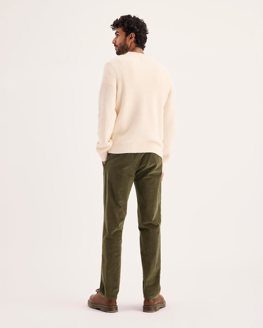 Back view of model wearing Dark Moss Ultimate Chino Pants with Smart 360 Flex™, Slim Fit.
