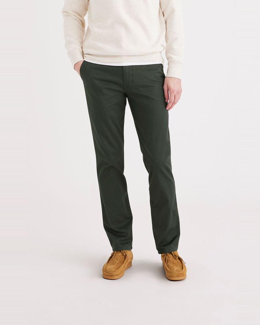 Front view of model wearing Deep Forest Men's Slim Fit Original Chino Pants.