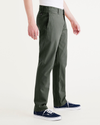 Side view of model wearing Deep Forest Men's Slim Fit Smart 360 Flex California Chino Pants.