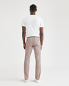 Back view of model wearing Fawn Men's Slim Fit Original Chino Pants.