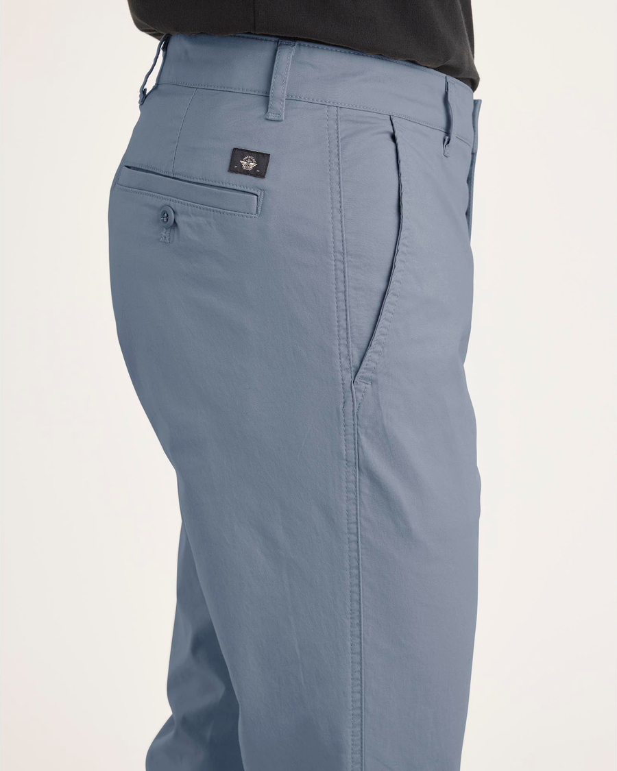Side view of model wearing Folkstone Gray Original Chino Pants, Skinny Fit.