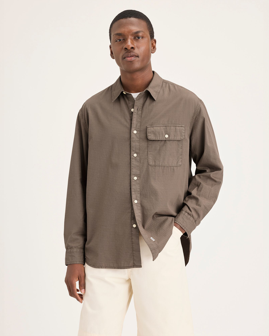 Front view of model wearing Fossil Garment Dye Men's Relaxed Fit Eighty-Six Shirt.