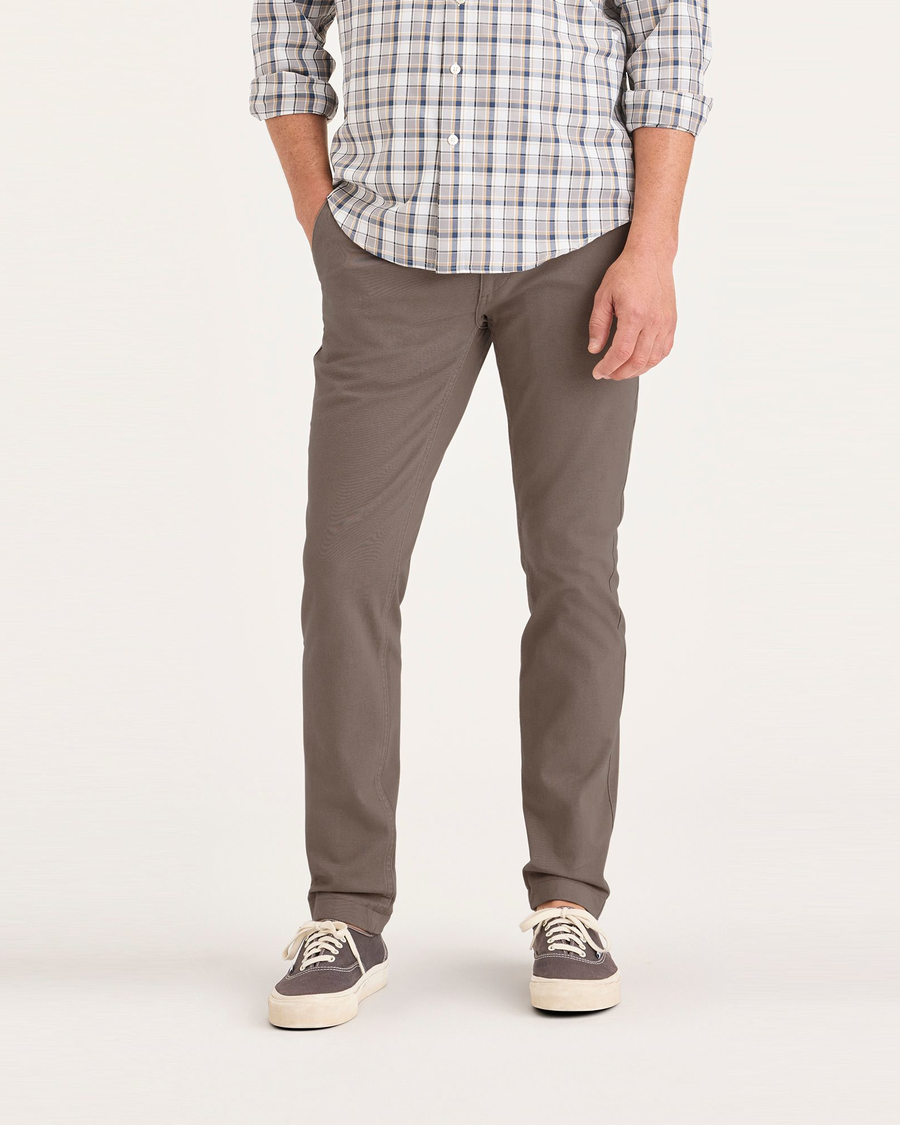 Front view of model wearing Fossil Men's Skinny Fit Smart 360 Flex California Chino Pants.