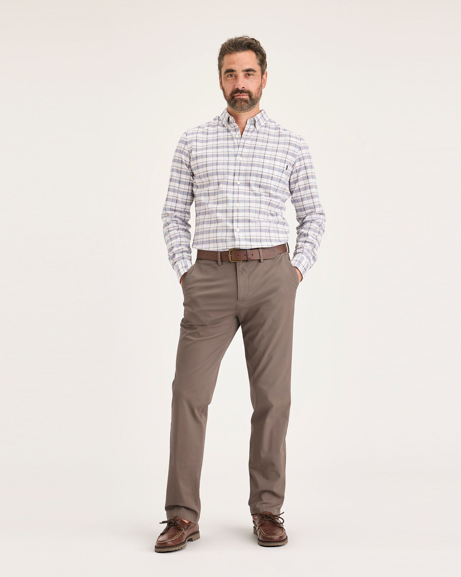 Front view of model wearing Fossil Men's Slim Fit Smart 360 Flex Alpha Chino Pants.