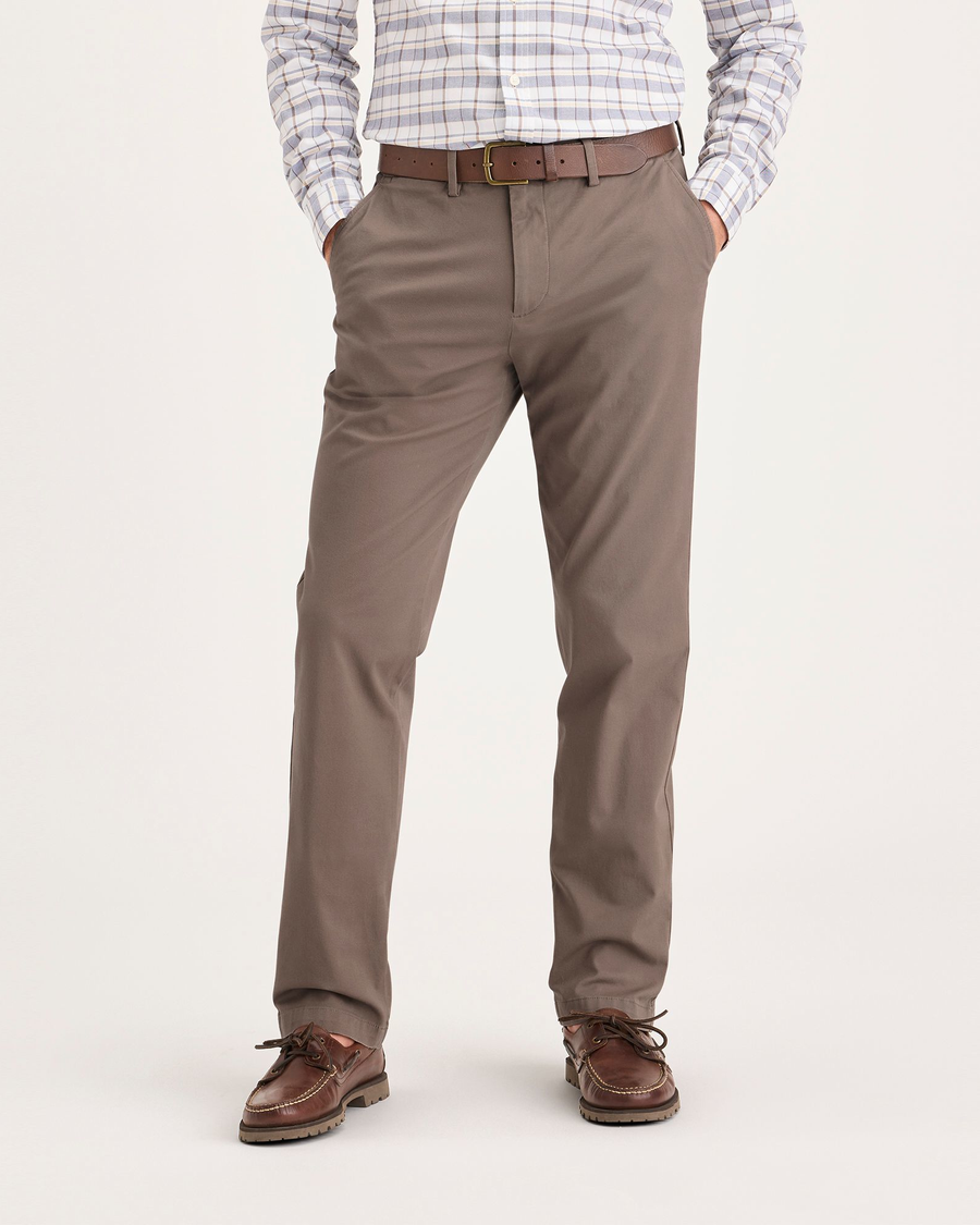 Front view of model wearing Fossil Men's Slim Fit Smart 360 Flex Alpha Chino Pants.