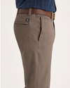 Side view of model wearing Fossil Men's Slim Fit Smart 360 Flex California Chino Pants.