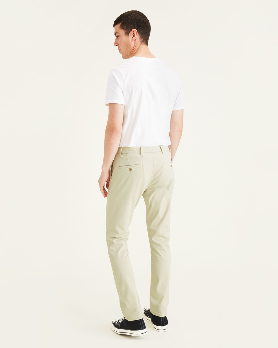 Back view of model wearing Gray Breeze Men's Skinny Fit Supreme Flex Alpha Khaki Pants.