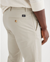 View of model wearing Grit Men's Slim Fit Smart 360 Flex Alpha Chino Pants.