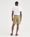 Back view of model wearing Harvest Gold Men's Classic Fit Original Pleated Shorts.