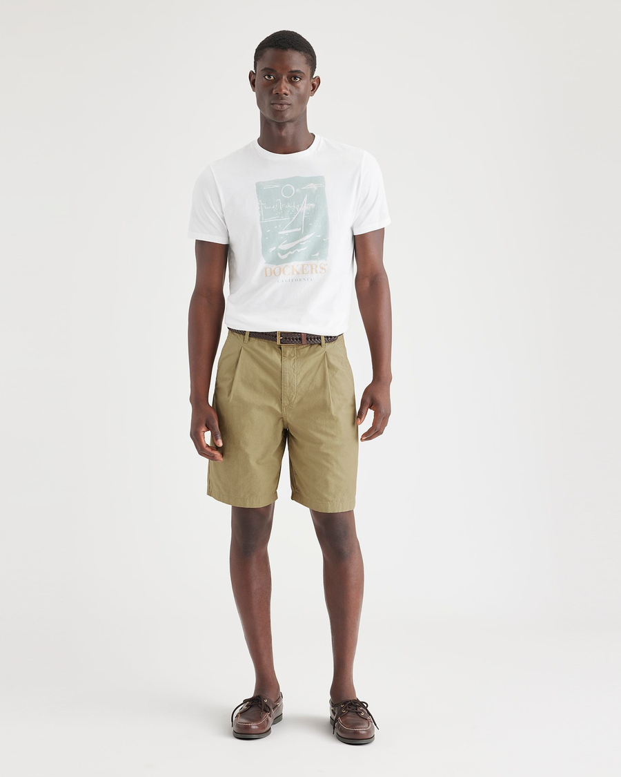 Front view of model wearing Harvest Gold Men's Classic Fit Original Pleated Shorts.