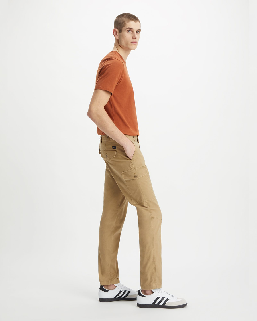 Side view of model wearing Harvest Gold Men's Slim Tapered Fit Cargo Pants.