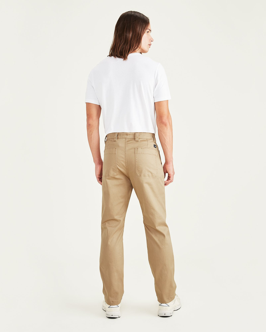 Back view of model wearing Harvest Gold Men's Straight Fit Utility Pants.