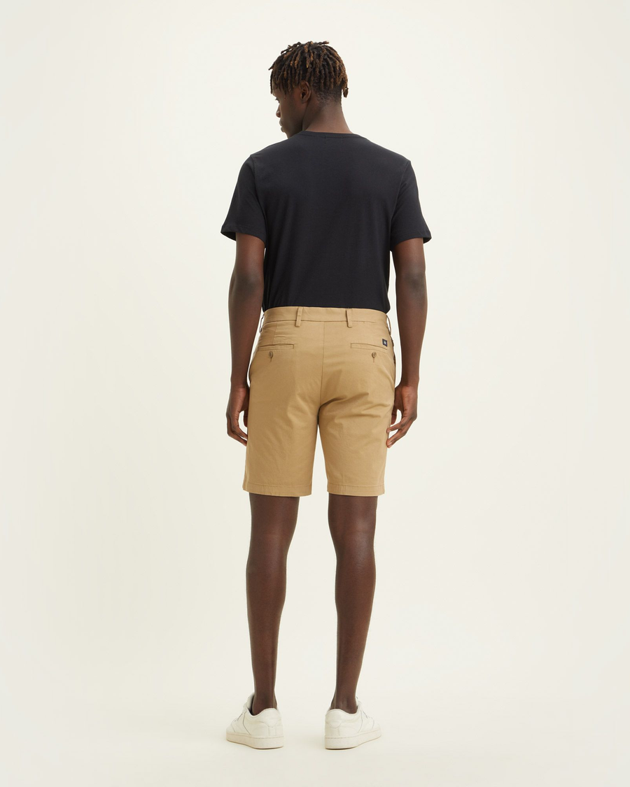 Back view of model wearing Harvest Gold Men's Supreme Flex Modern Chino Short.