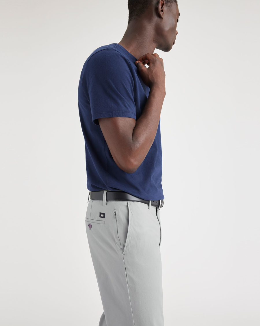 View of model wearing High-Rise Men's Slim Fit Smart 360 Flex Alpha Chino Pants.