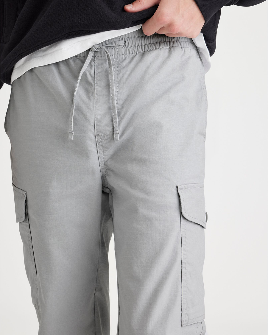 View of model wearing High-Rise Men's Straight Tapered Fit Cargo Jogger Pants.