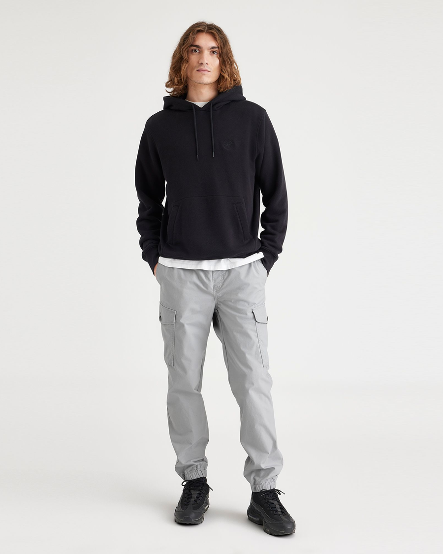 Front view of model wearing High-Rise Men's Straight Tapered Fit Cargo Jogger Pants.